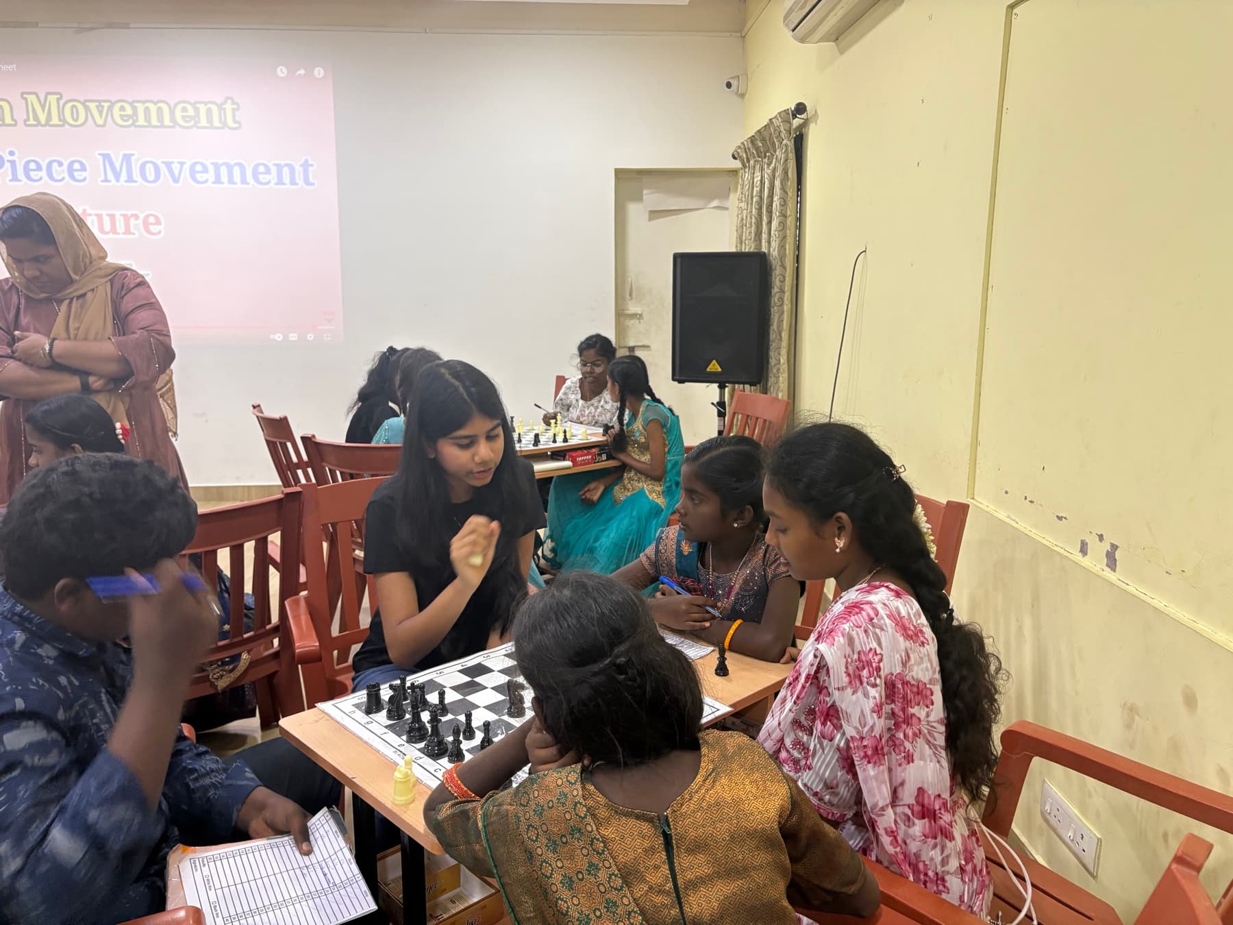 Girls playing chess at a Chess4Girls event